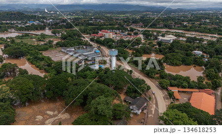 Aerial view of suburb area in Chiang Rai province flooding by Kok river after typhoon Yagi has swept Southeast Asia. Aerial view of suburb area in Chiang Rai province flooding by Kok river after typhoon Yagi has swept Southeast Asia. 134618253