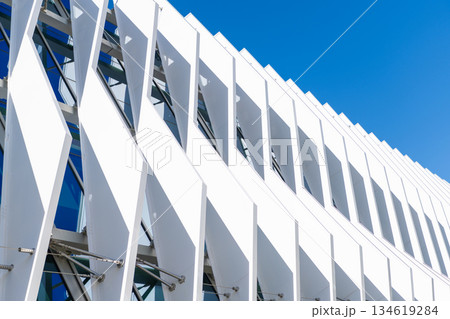 Modern apartment building. Apartment building with detail. View of building structure. Structural building architecture. Architectural exterior construction detail. Structural exterior fragment 134619284
