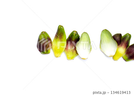 Artichoke petals on white background. 134619413