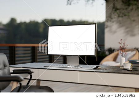 White screen computer on black marble table and armchair at the rooftop of a house or building. 134619962