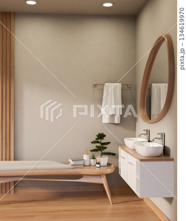 Spa essentials with bonsai atop wooden cushion bench or table in bathroom with odd shape mirror. Spa essentials with bonsai atop wooden cushion bench or table in bathroom with odd shape mirror. 134619970