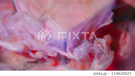 Shiny ink drop. Blurred fluid blend. Color liquid spill on art cube. Pink purple red pigment underwater dissolving abstract background. Shiny ink drop. Blurred fluid blend. Color liquid spill on art cube. Pink purple red pigment underwater dissolving abstract background. 134620025