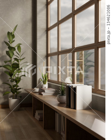 Books and coffee with pot plants on wooden bookshelf counter under glass wall of living room or cafe 134621086