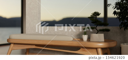 Wooden spa massage chair and bonsai with potted plant placing beside loft wall partitions in a room. 134621920