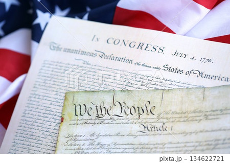 Aged historical documents Washington DC on American Declaration of independence 4th july 1776 on U.S. flag close up 134622721