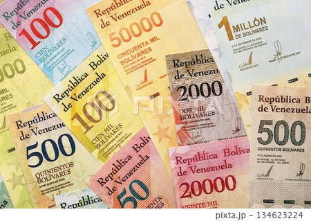 Venezuelan Bolivar currency money bills in pile. VED currency banknotes with different denomination close up Venezuelan Bolivar currency money bills in pile. VED currency banknotes with different denomination close up 134623224