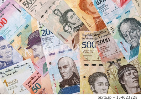 Venezuelan Bolivar currency money bills in big amount. Heap of VED currency banknotes with different denomination close up 134623228