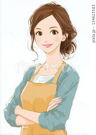 エプロンを付けた若い女性 134623583