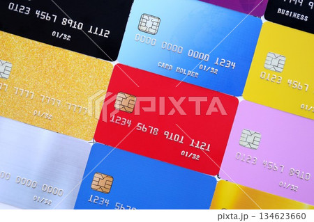 Many credit or debit cards with fictional specimen numbers. Big amount of banking plastic cards of various colors. Financial concept of business and e-commerce 134623660