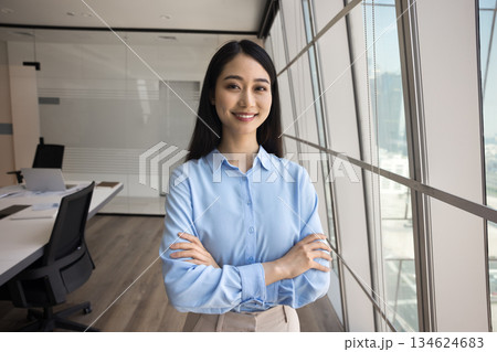 Confident Asian businesswoman, staff member posing in conference room 134624683
