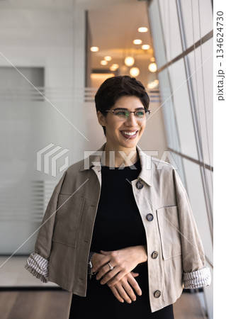 Vertical office portrait of cheerful Armenian businesswoman 134624730