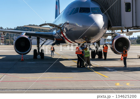 Sochi, Russia - July 20 2024: An airplane cabin docked at the airport terminal. Sochi, Russia - July 20 2024: An airplane cabin docked at the airport terminal. 134625200
