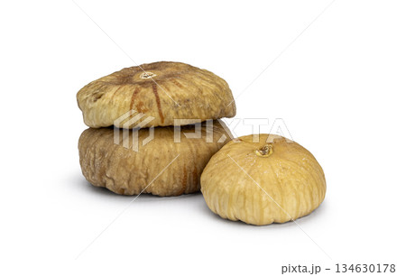 Dried figs stacking together on white background Dried figs stacking together on white background 134630178
