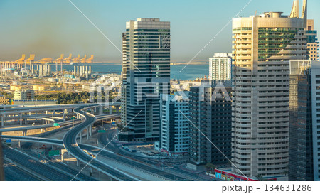 Dubai Marina skyscrapers aerial top view at sunrise from JLT in Dubai timelapse, UAE. Dubai Marina skyscrapers aerial top view at sunrise from JLT in Dubai timelapse, UAE. 134631286