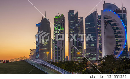 The high-rise district of Doha day to night timelapse after sunset 134631321