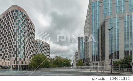 Timelapse panorama of traffic and modern office buildings in the business district on Boulevard Baudouin, Brussels, Belgium. 134631356