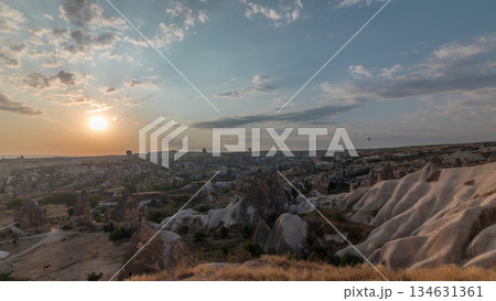 Beautiful sunrise with colorful hot air balloons take off and flying in clear morning sky aerial timelapse in Cappadocia, Turkey Beautiful sunrise with colorful hot air balloons take off and flying in clear morning sky aerial timelapse in Cappadocia, Turkey 134631361
