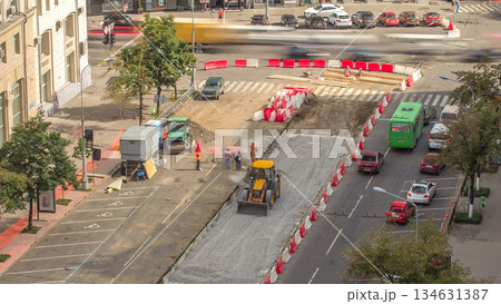 The bulldozer moves and spreads the soil and rubble on the road timelapse. The bulldozer moves and spreads the soil and rubble on the road timelapse. 134631387