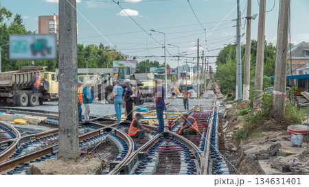 Repair works on the street timelapse. Laying of new tram rails on a city street. Repair works on the street timelapse. Laying of new tram rails on a city street. 134631401