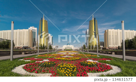 A square in front of Ak Orda with Altyn Orda business center timelapse hyperlapse in the foreground. 134631577