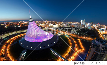 Elevated aerial view over the city center with Khan Shatyr day to night timelapse, Kazakhstan, Astana Elevated aerial view over the city center with Khan Shatyr day to night timelapse, Kazakhstan, Astana 134631598