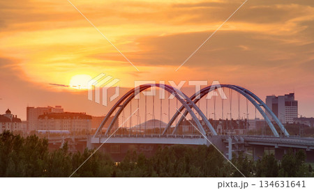 Sunset timelapse above the Bridge with the transport and clouds on the background. Central Asia, Kazakhstan, Astana 134631641