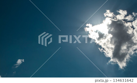 Beautiful cloudscape timelapse with large, building clouds and sunrise breaking through cloud mass. Beautiful cloudscape timelapse with large, building clouds and sunrise breaking through cloud mass. 134631642