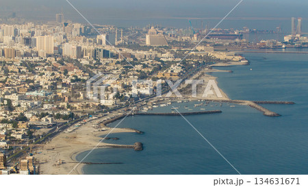 Panoramic view of Sharjah coastline from Ajman rooftop timelapse - third largest and most populous city in United Arab Emirates Panoramic view of Sharjah coastline from Ajman rooftop timelapse - third largest and most populous city in United Arab Emirates 134631671