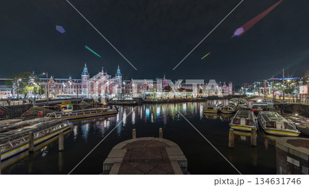 Panorama showing illuminated Central Railway station night timelapse. Amsterdam, The Netherlands 134631746