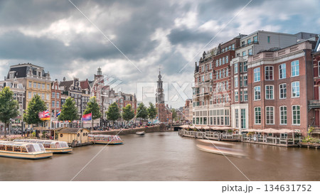 Panoramic timelapse hyperlapse of Amsterdam city center featuring Amstel River, waterfront and Munttoren tower. Netherlands Panoramic timelapse hyperlapse of Amsterdam city center featuring Amstel River, waterfront and Munttoren tower. Netherlands 134631752