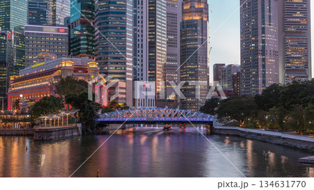 Singapore skyscrapers skyline with white Anderson Bridge near esplanade park day to night timelapse. Singapore skyscrapers skyline with white Anderson Bridge near esplanade park day to night timelapse. 134631770