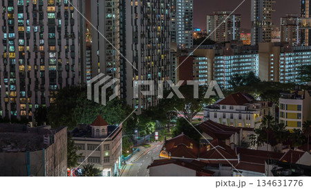 Aerial view of intersection and art deco shophouses along Neil road in Chinatown area night timelapse 134631776