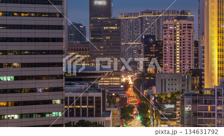 Evening panorama with Marina Bay area and skyscrapers city skyline aerial day to night timelapse. Evening panorama with Marina Bay area and skyscrapers city skyline aerial day to night timelapse. 134631792