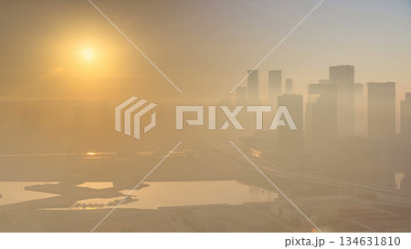 Abu Dhabi city skyline with skyscrapers at sunrise from above timelapse 134631810