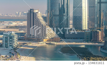 Buildings on Al Reem island in Abu Dhabi timelapse from above. Buildings on Al Reem island in Abu Dhabi timelapse from above. 134631811