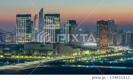 Buildings on Al Reem island in Abu Dhabi day to night timelapse from above. Buildings on Al Reem island in Abu Dhabi day to night timelapse from above. 134631812