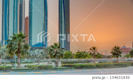 Skyscrapers of Abu Dhabi at sunset with Etihad Towers buildings timelapse. Skyscrapers of Abu Dhabi at sunset with Etihad Towers buildings timelapse. 134631830