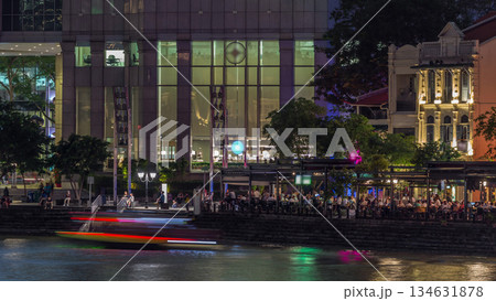 Singapore quay with tall skyscrapers in the central business district on Boat Quay day to night timelapse 134631878