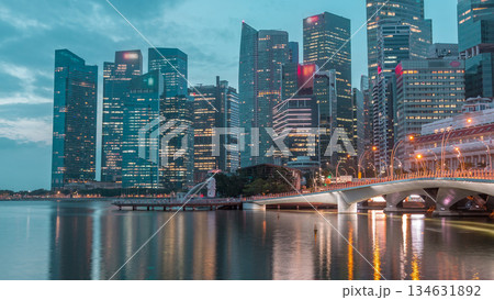 Esplanade bridge and downtown core skyscrapers in the background Singapore night to day timelapse Esplanade bridge and downtown core skyscrapers in the background Singapore night to day timelapse 134631892