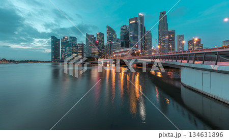 Esplanade bridge and downtown core skyscrapers in the background Singapore night to day timelapse Esplanade bridge and downtown core skyscrapers in the background Singapore night to day timelapse 134631896