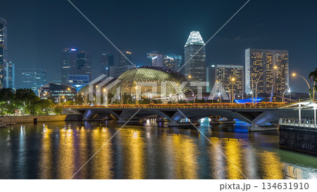 Illuminated Double Esplanade Theatres domes behind Esplanade Drive with traffic night timelapse hyperlapse 134631910