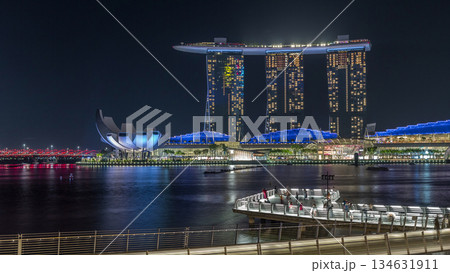 The Merlion fountain spouts water in front of the Marina Bay Sands hotel in Singapore timelapse hyperlapse. 134631911