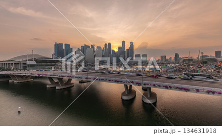 Aerial view of sunset over Helix Bridge and Bayfront Avenue with traffic timelapse at Marina Bay, Singapore Aerial view of sunset over Helix Bridge and Bayfront Avenue with traffic timelapse at Marina Bay, Singapore 134631918