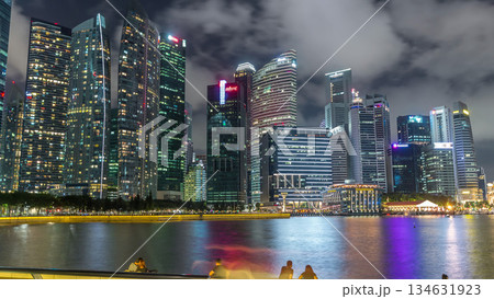 Business Financial Downtown City and Skyscrapers Tower Building at Marina Bay night timelapse hyperlapse, Singapore Business Financial Downtown City and Skyscrapers Tower Building at Marina Bay night timelapse hyperlapse, Singapore 134631923