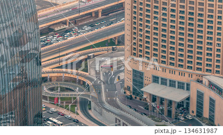 Dubai downtown street with busy traffic and skyscrapers around timelapse. Dubai downtown street with busy traffic and skyscrapers around timelapse. 134631987