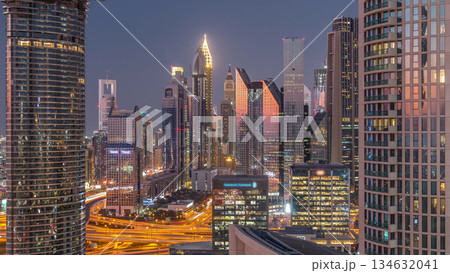 Dubai International Financial Centre district with modern skyscrapers day to night timelapse Dubai International Financial Centre district with modern skyscrapers day to night timelapse 134632041