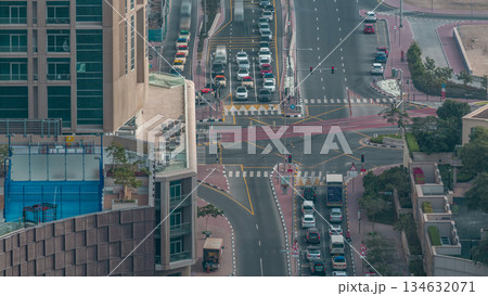 Aerial view of a road intersection in a big city timelapse. 134632071
