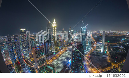 Skyline of the buildings of Sheikh Zayed Road and DIFC aerial night timelapse in Dubai, UAE. Skyline of the buildings of Sheikh Zayed Road and DIFC aerial night timelapse in Dubai, UAE. 134632091