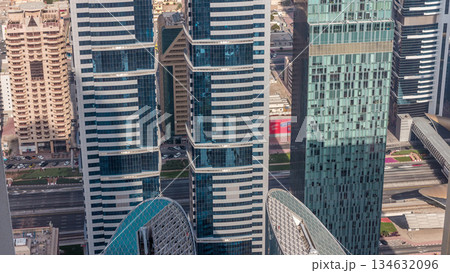 Skyline view of the buildings of Sheikh Zayed Road and DIFC aerial timelapse in Dubai, UAE. Skyline view of the buildings of Sheikh Zayed Road and DIFC aerial timelapse in Dubai, UAE. 134632096