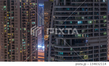 Residential and office buildings in Jumeirah lake towers district night timelapse in Dubai Residential and office buildings in Jumeirah lake towers district night timelapse in Dubai 134632114